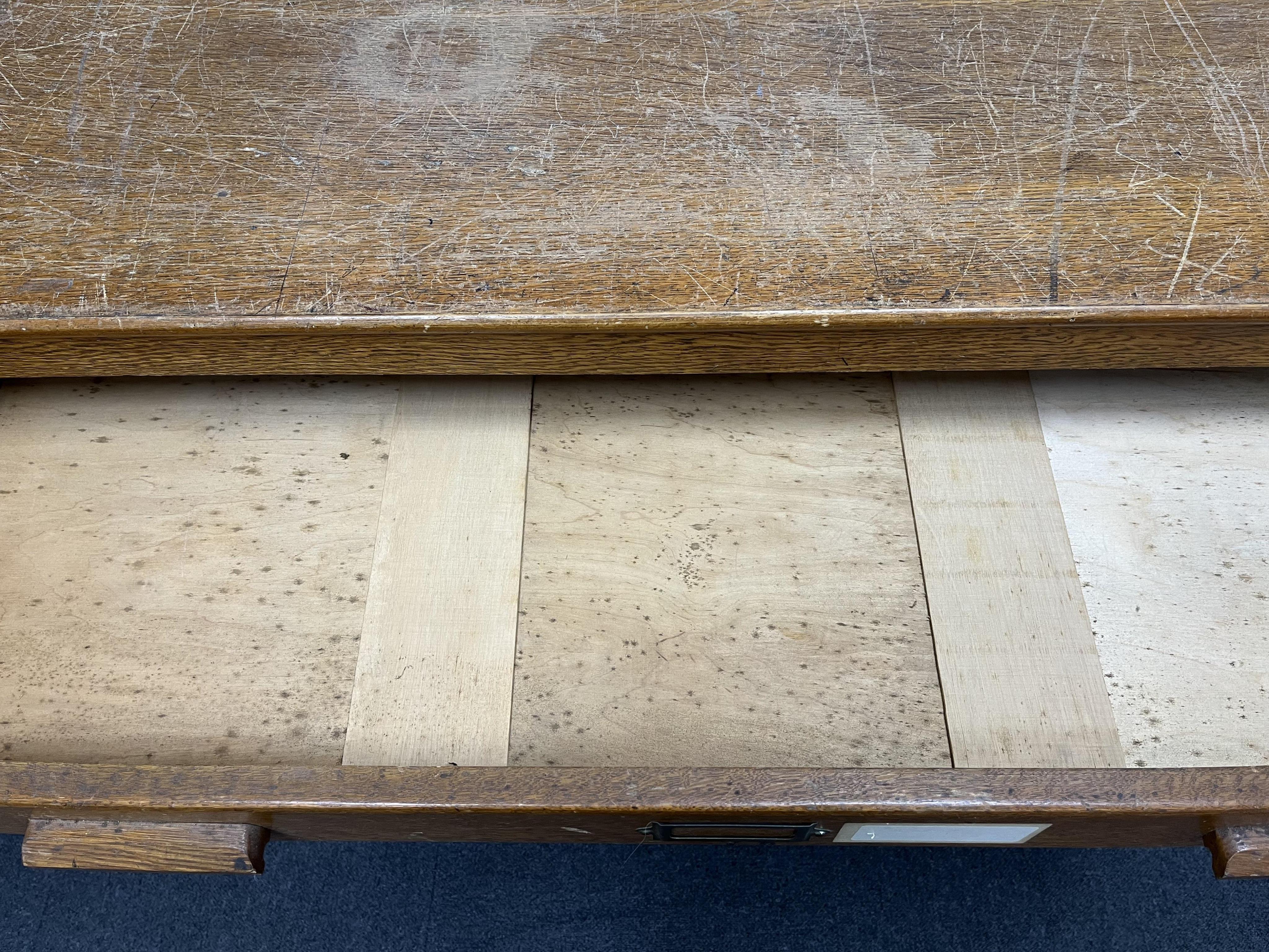A 1930's light oak plan chest in two sections, width 113cm, depth 82cm, height 92cm